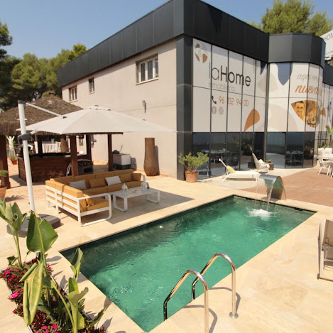 Outdoor area and pool at laHome Real Estate
